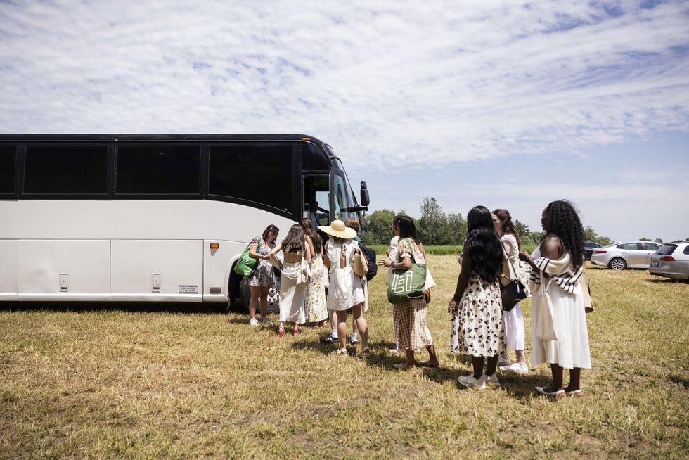 People getting on the bus.