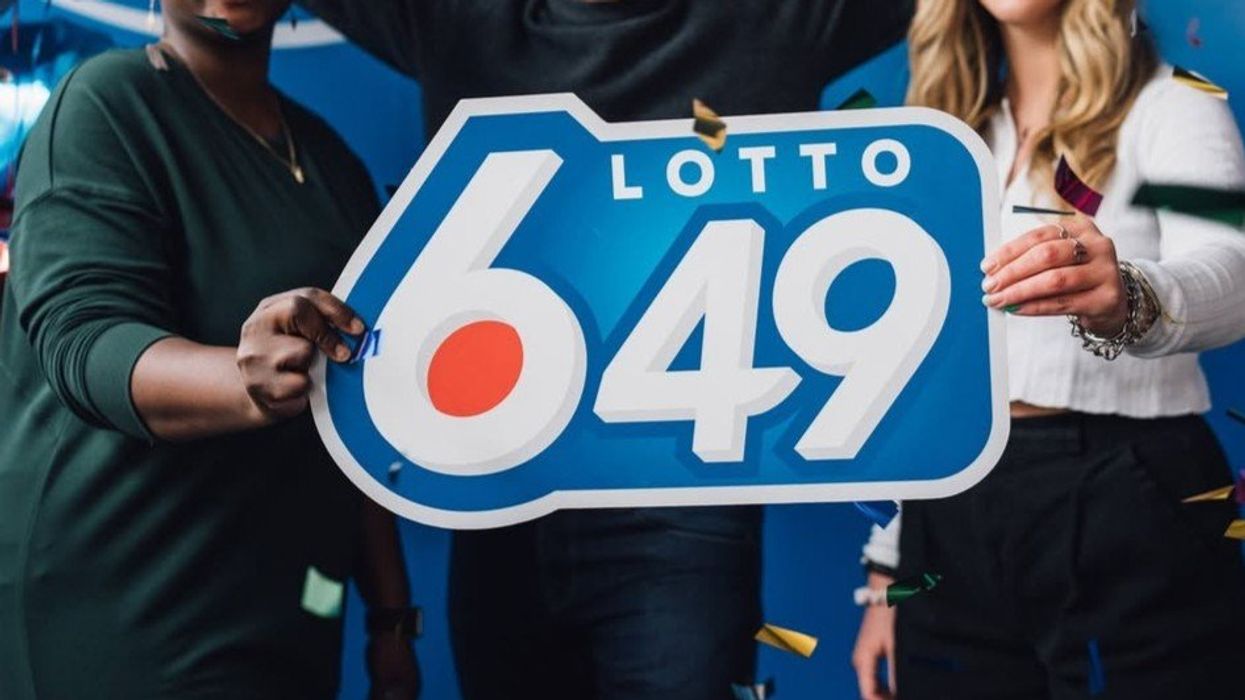 people holding lotto 6/49 sign