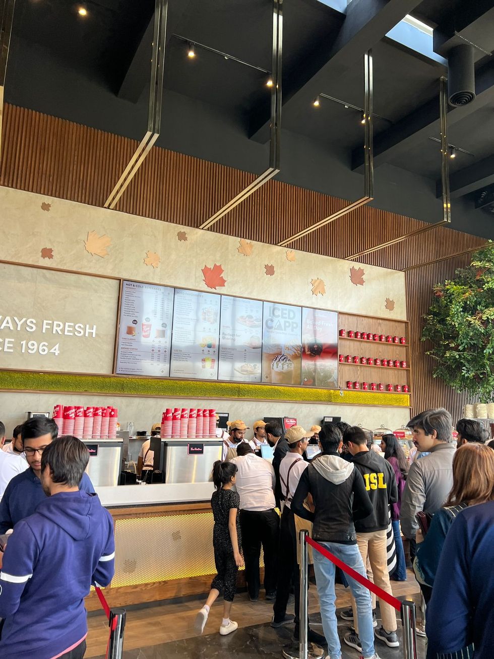 People lining up to order at Tim Hortons Lahore.