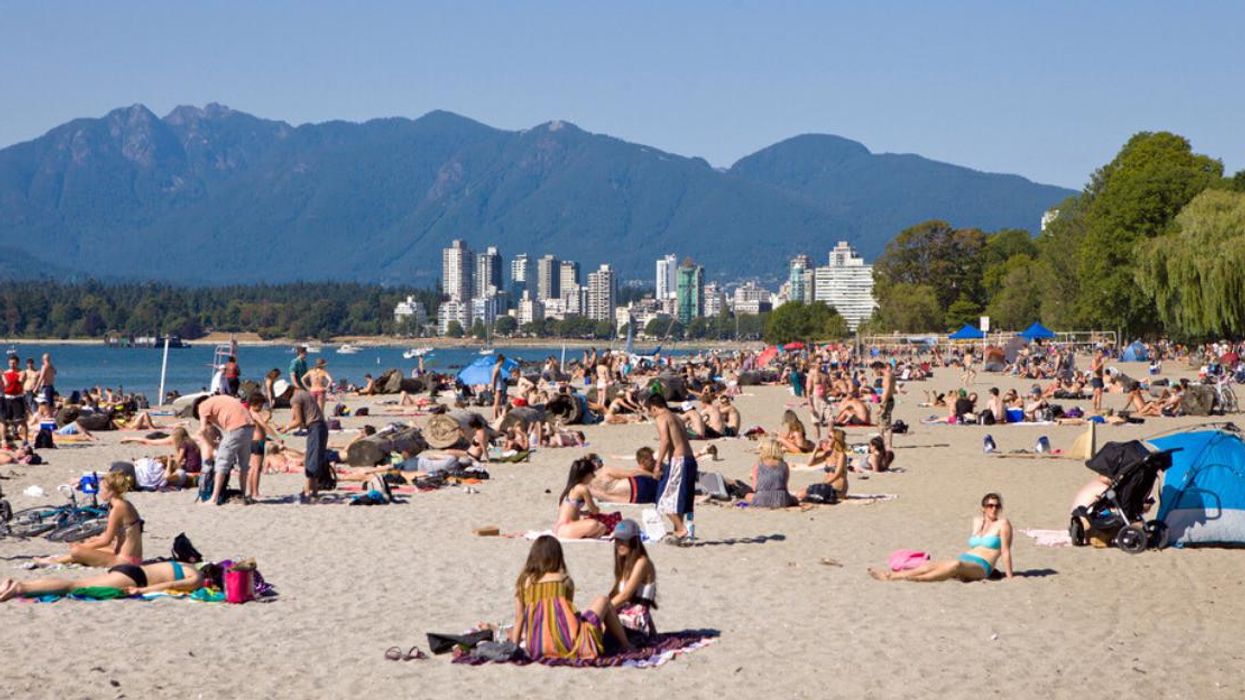 People lying on a beach in Vancouver, B.C..
