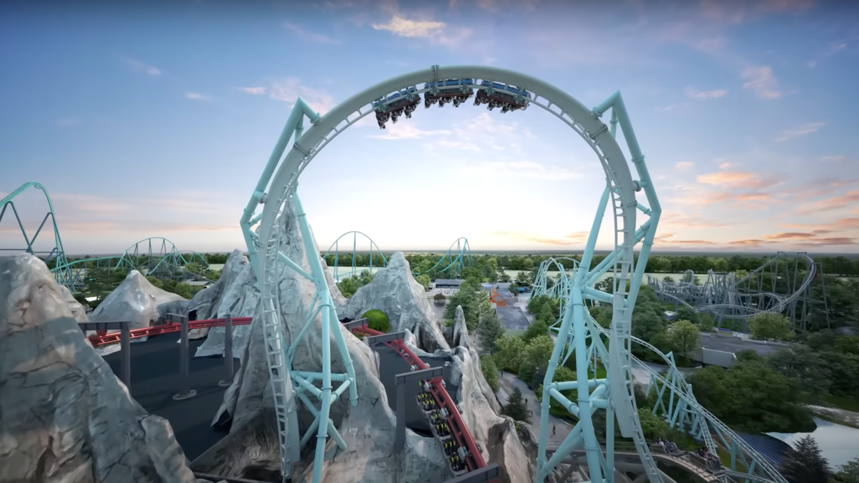 People riding a roller coaster.