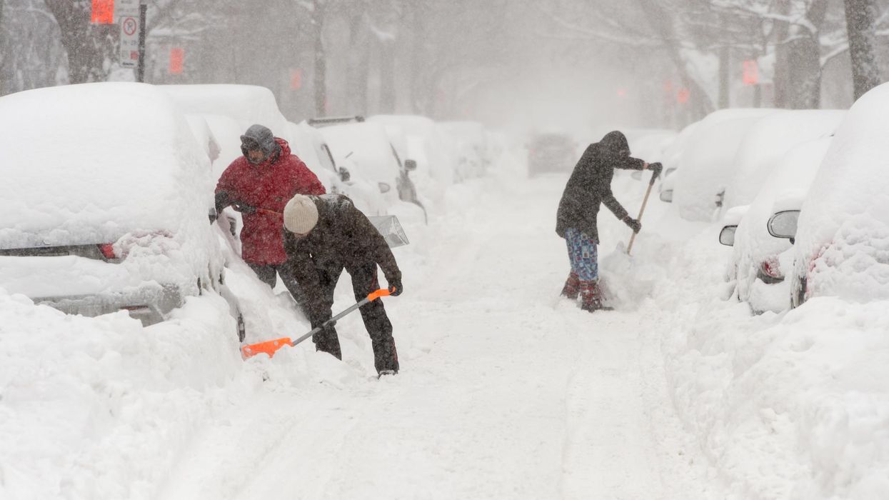 People shovelling snow in Ontario