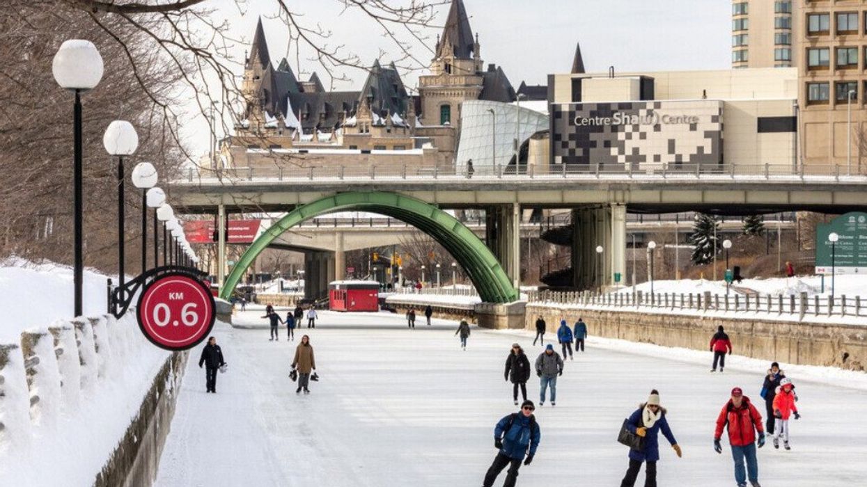 People skating on an ice rink.