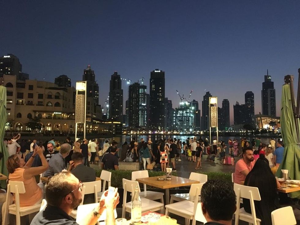 People taking pictures near the Dubai Fountain.