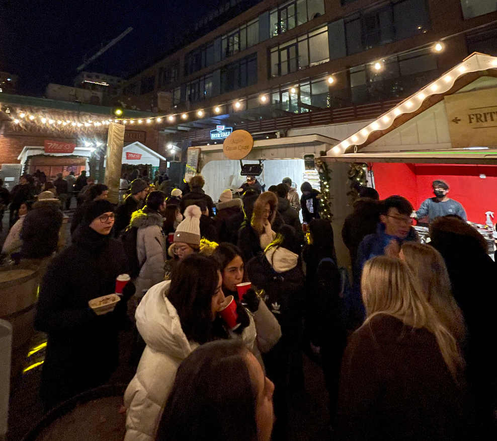 People waiting in line to get food.