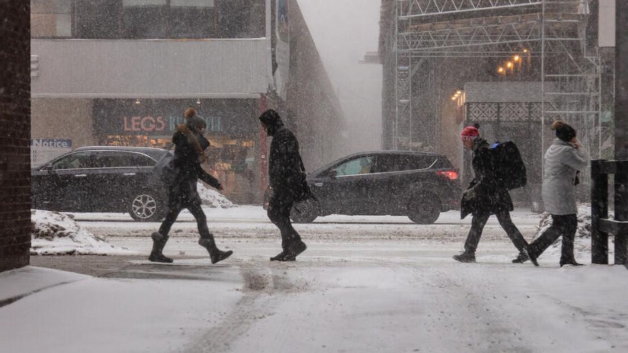People walking in snowstorm in Toronto.