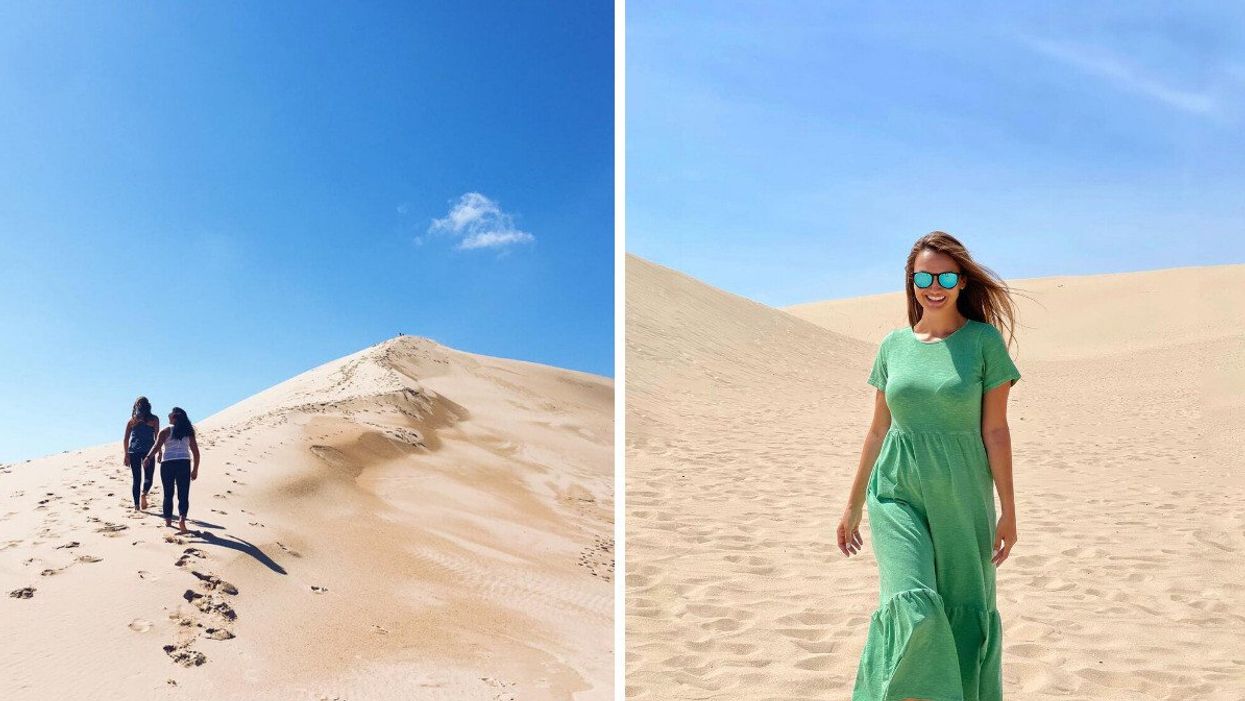 People walking on sand dunes.