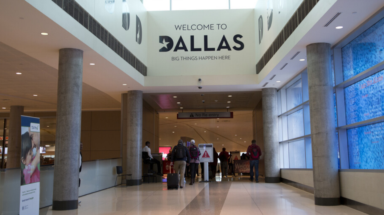 People walking through the Dallas Love Field Airport.