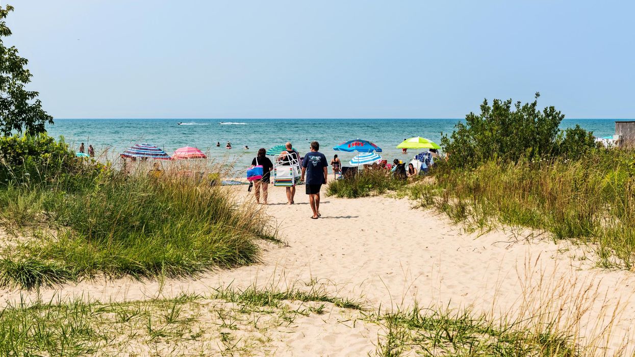 People walking toward Sauble Beach in Ontario.