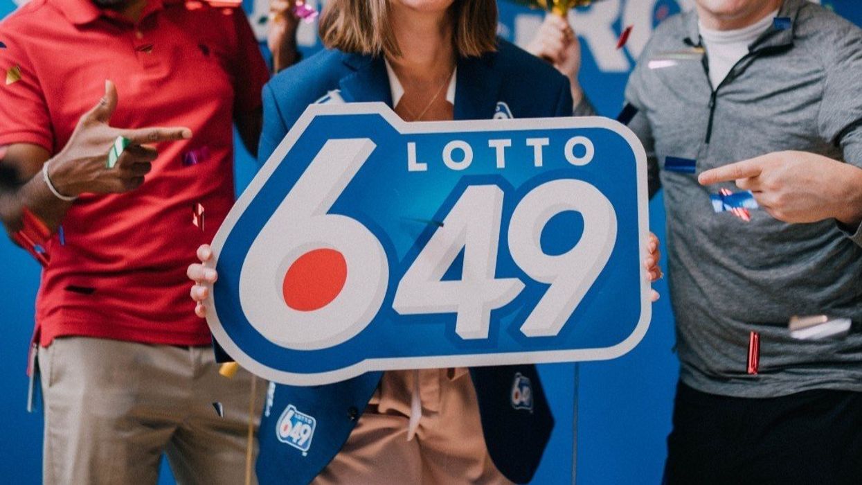 people with a lotto 6/49 sign