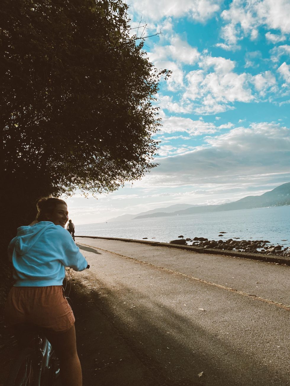 Person biking the seawall in Vancouver.