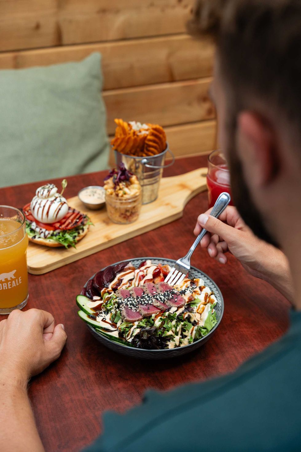 Person enjoying a meal at a restaurant.