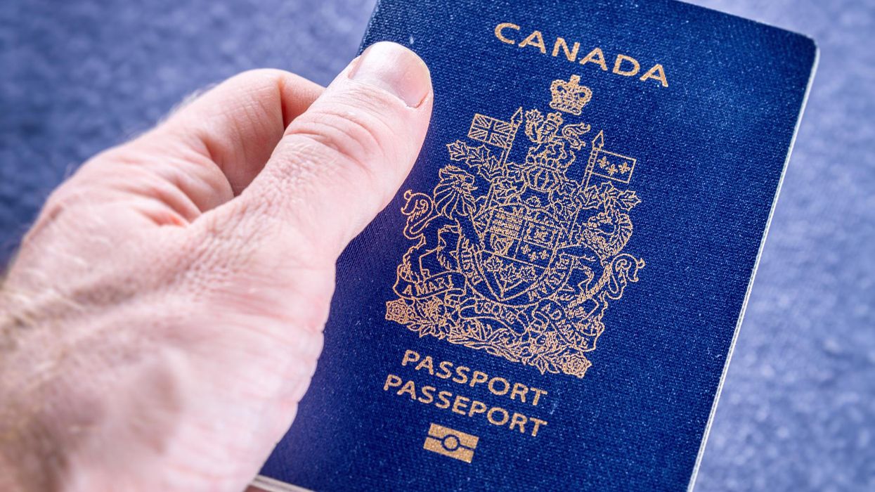 Person holding a Canadian passport.