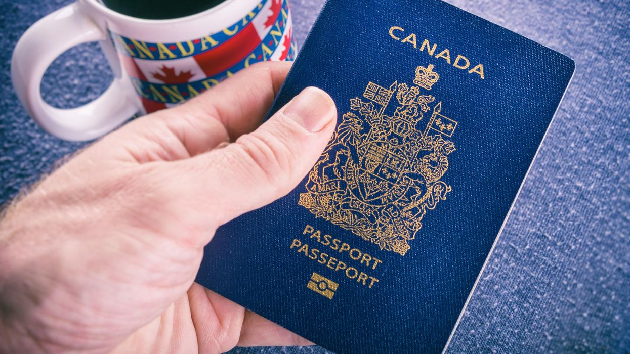 Person holding a Canadian passport.