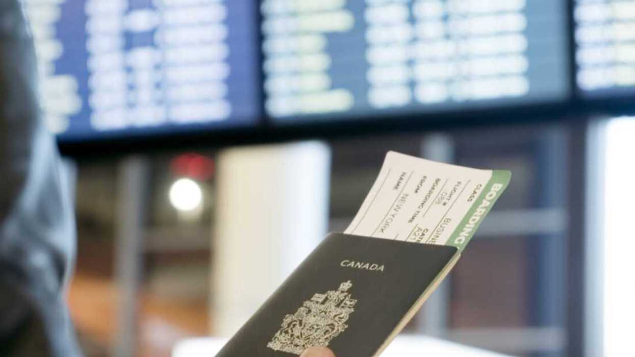 Person holding a Canadian passport.
