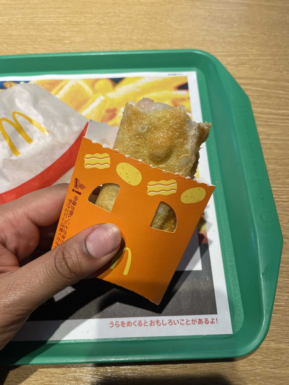 Person holding a McDonald's Bacon Potato Pie