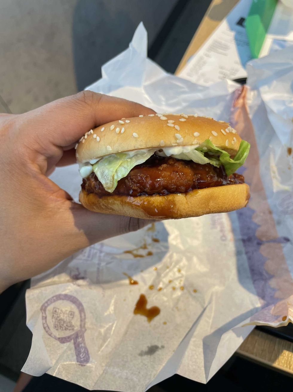 Person holding a Teriyaki Chicken Filet-O from McDonald's