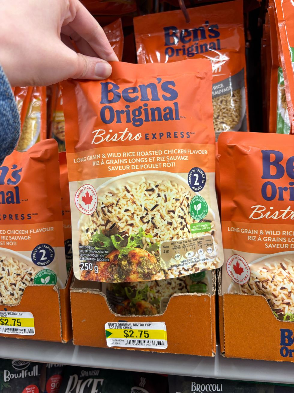 person holding bag of ben's original bistro express rice