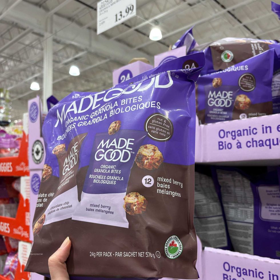 person holding bag of Made Good granola bites at costco