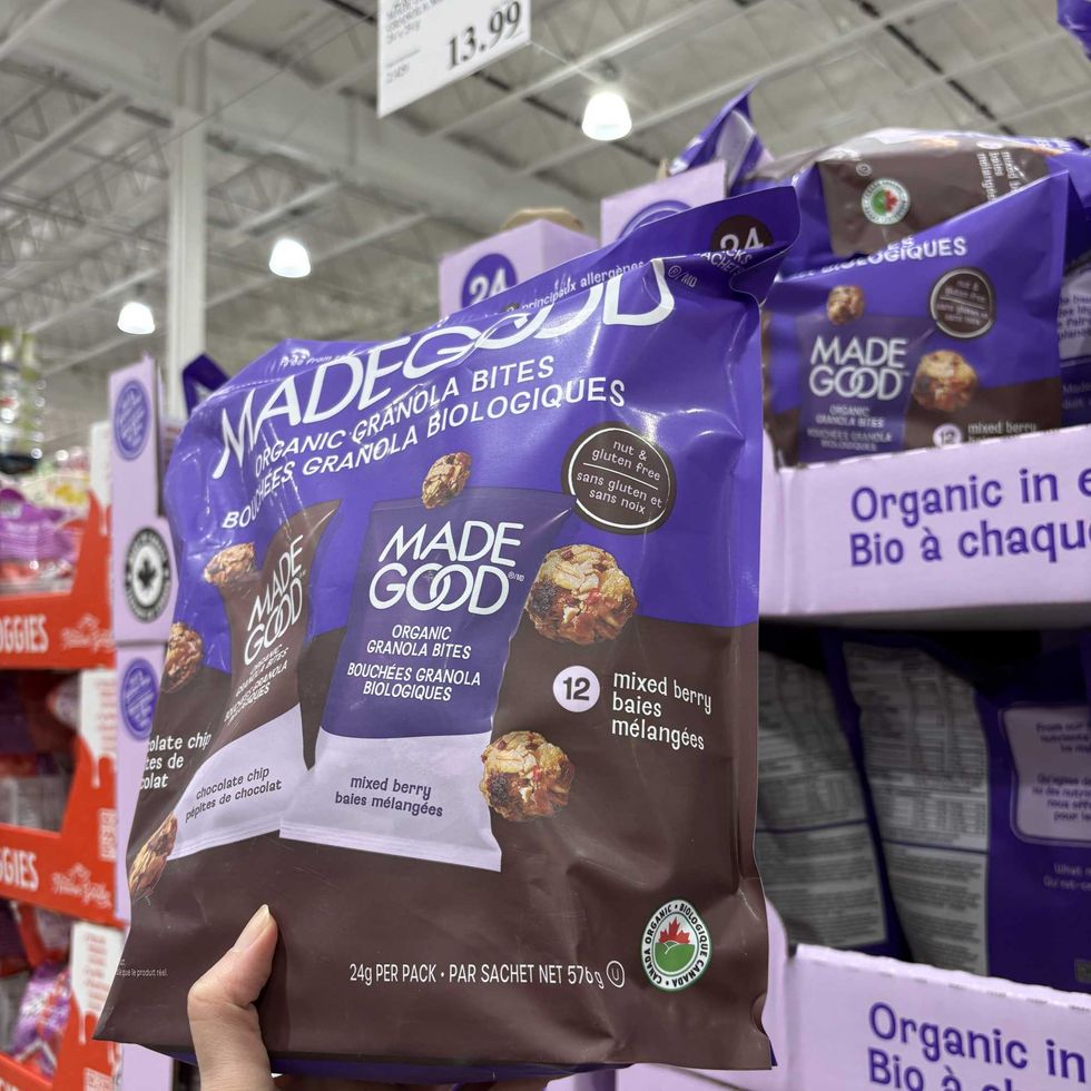 person holding bag of Made Good granola bites at costco