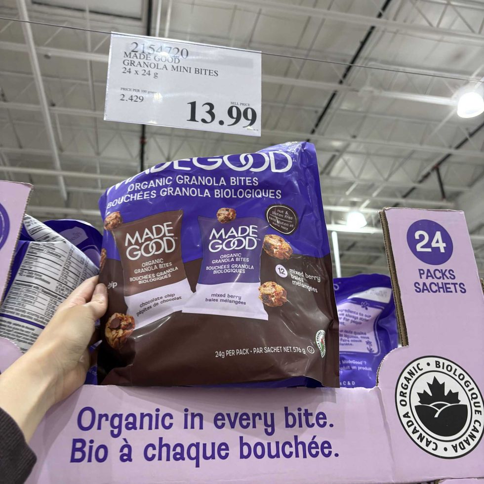 person holding bag of Made Good mini granola bites at costco