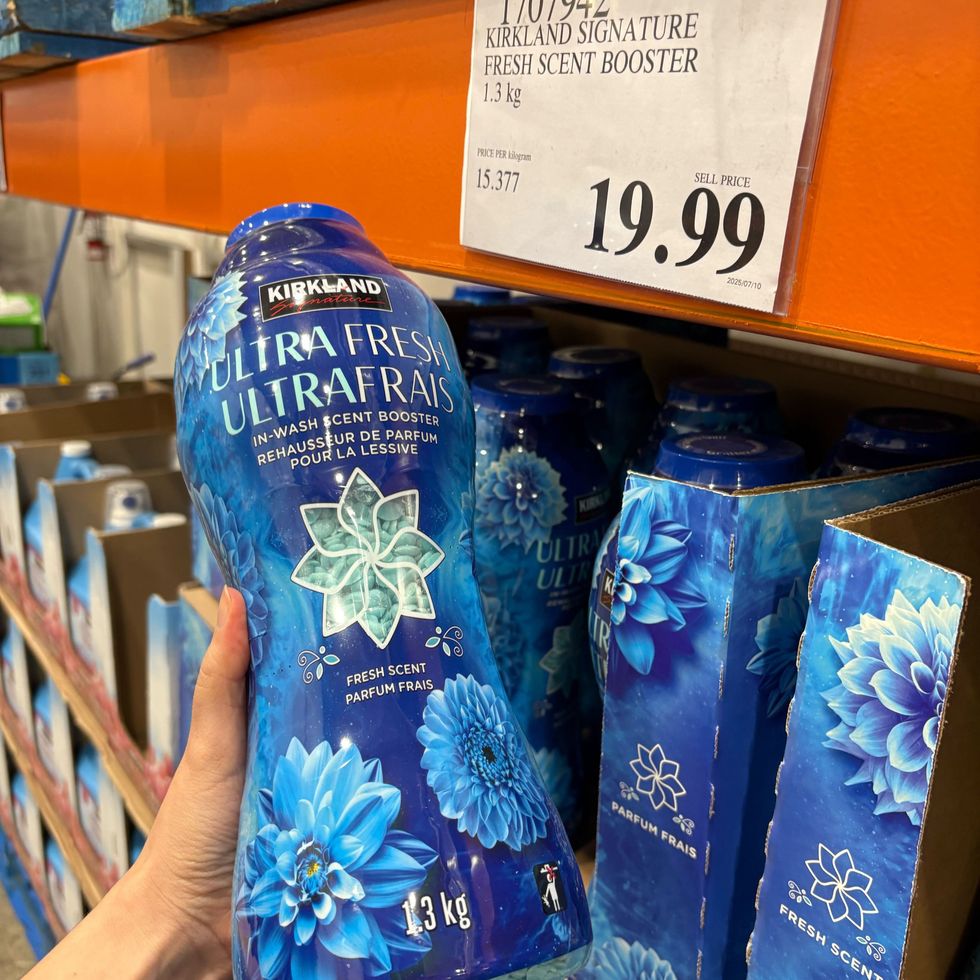 person holding bottle of Kirkland Signature Ultra Fresh laundry beads