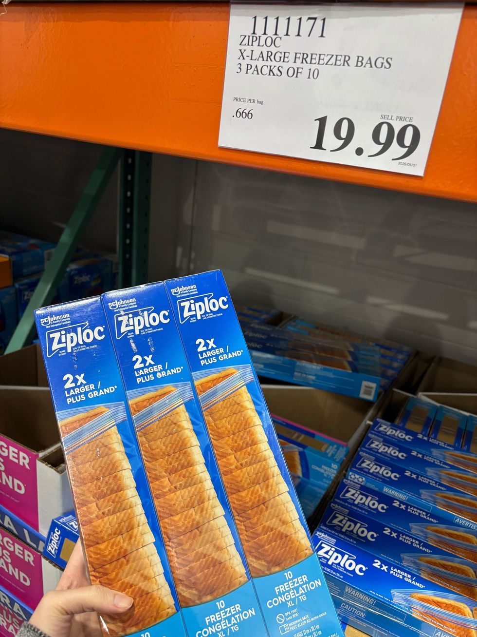 person holding box of ziploc bags at costco