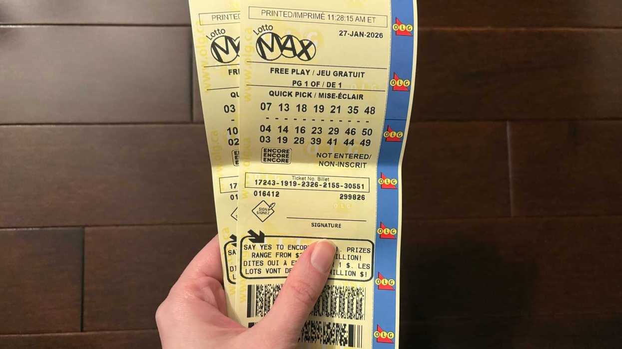 person holding lotto max tickets sold by olg