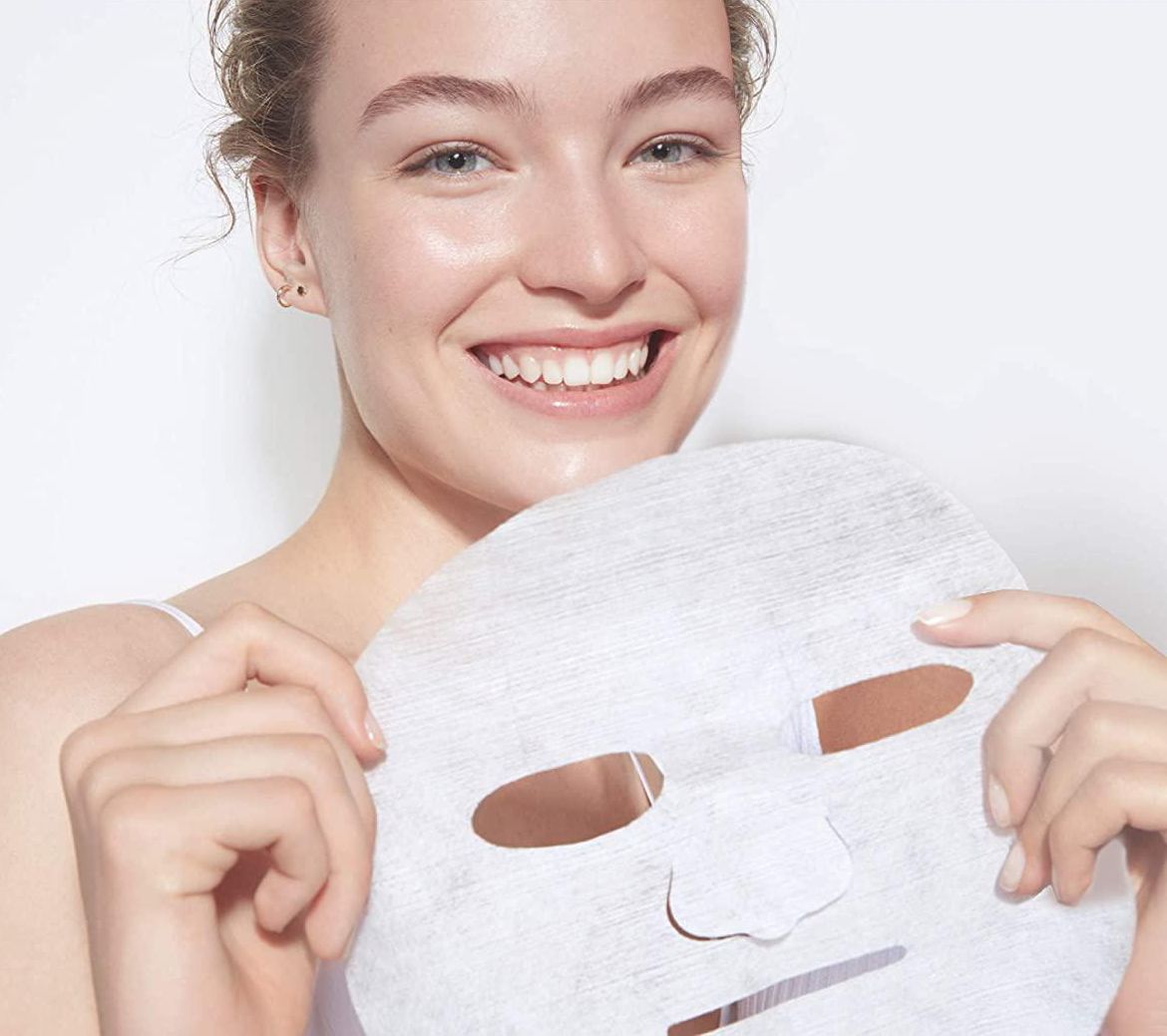person holding the sheet mask