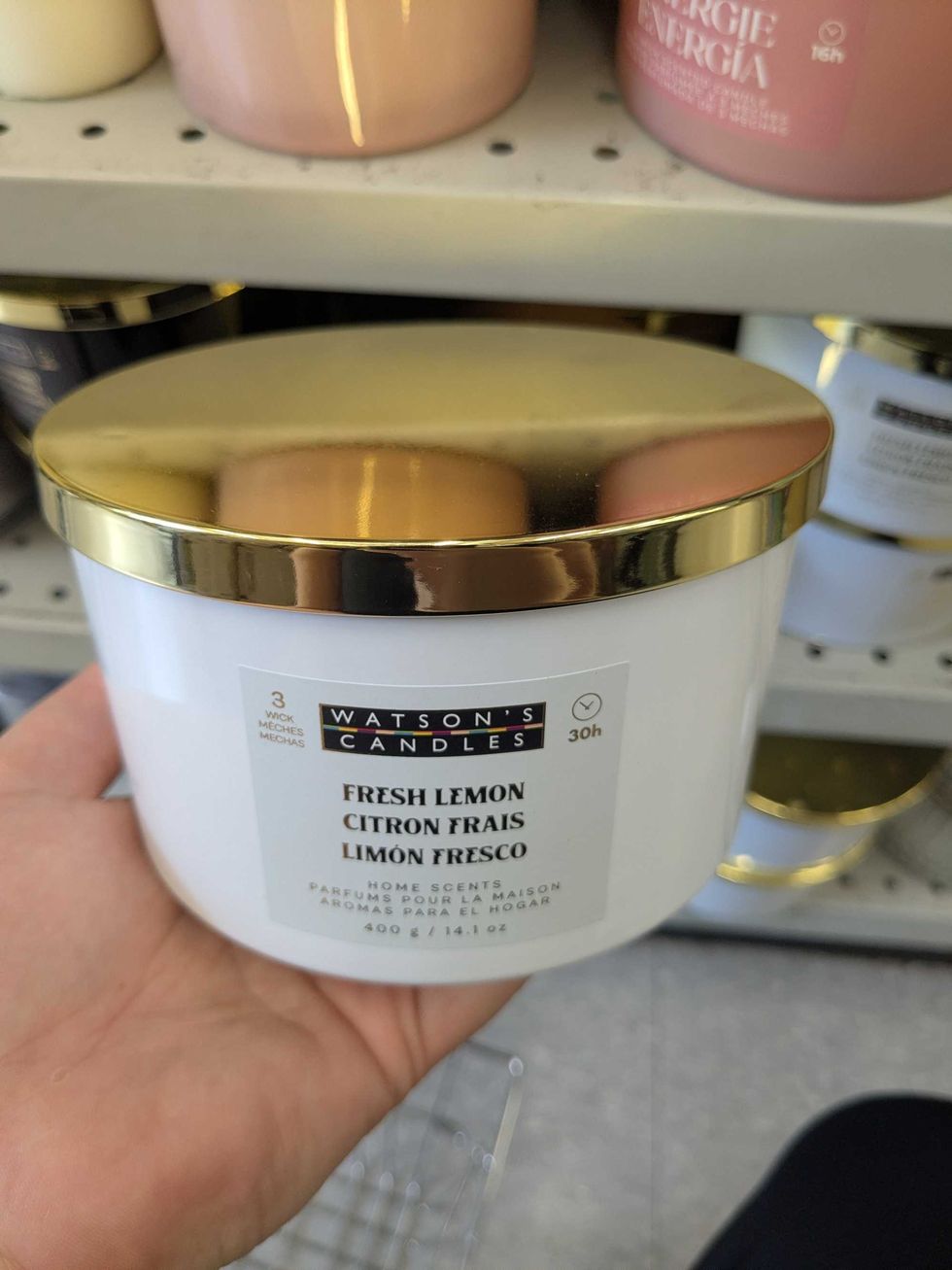 Person holding up a large can
