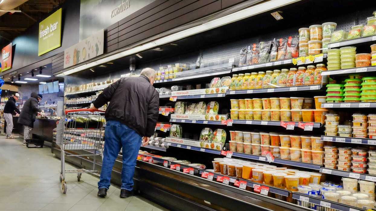 person in aisle at grocery store in canada