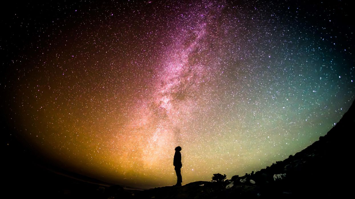 Person looking up at the starry sky.