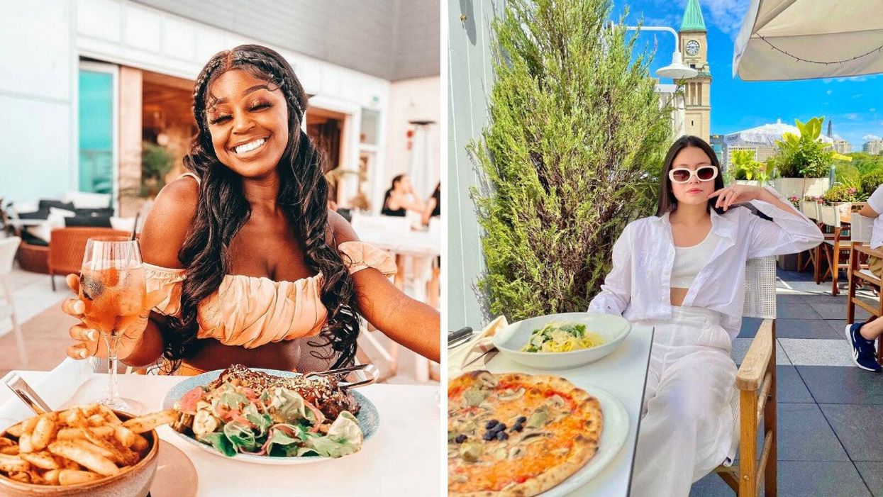 Person on a patio with a table of food.