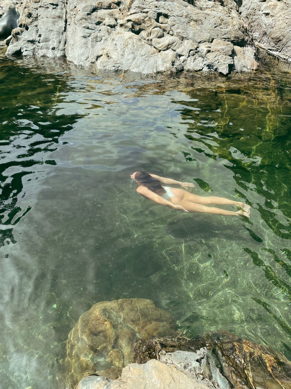 Person swimming at Sooke Potholes.