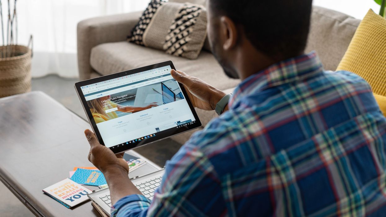 Person using LinkedIn on a laptop.