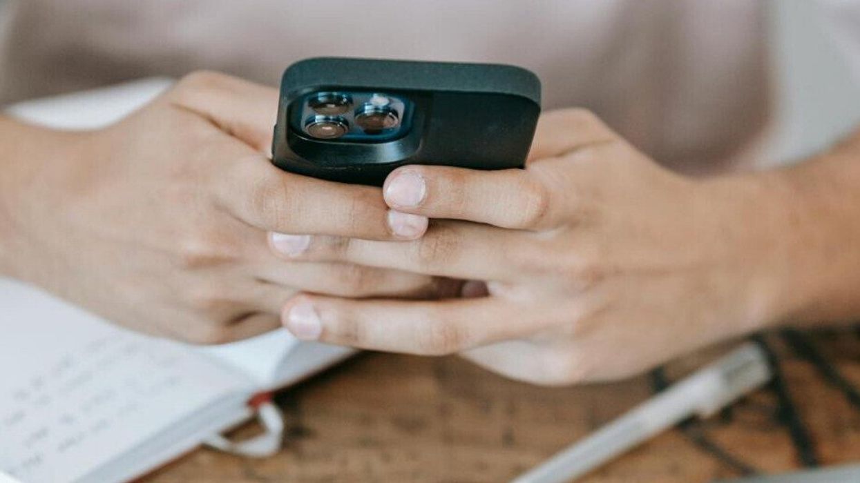 Person using smartphone.