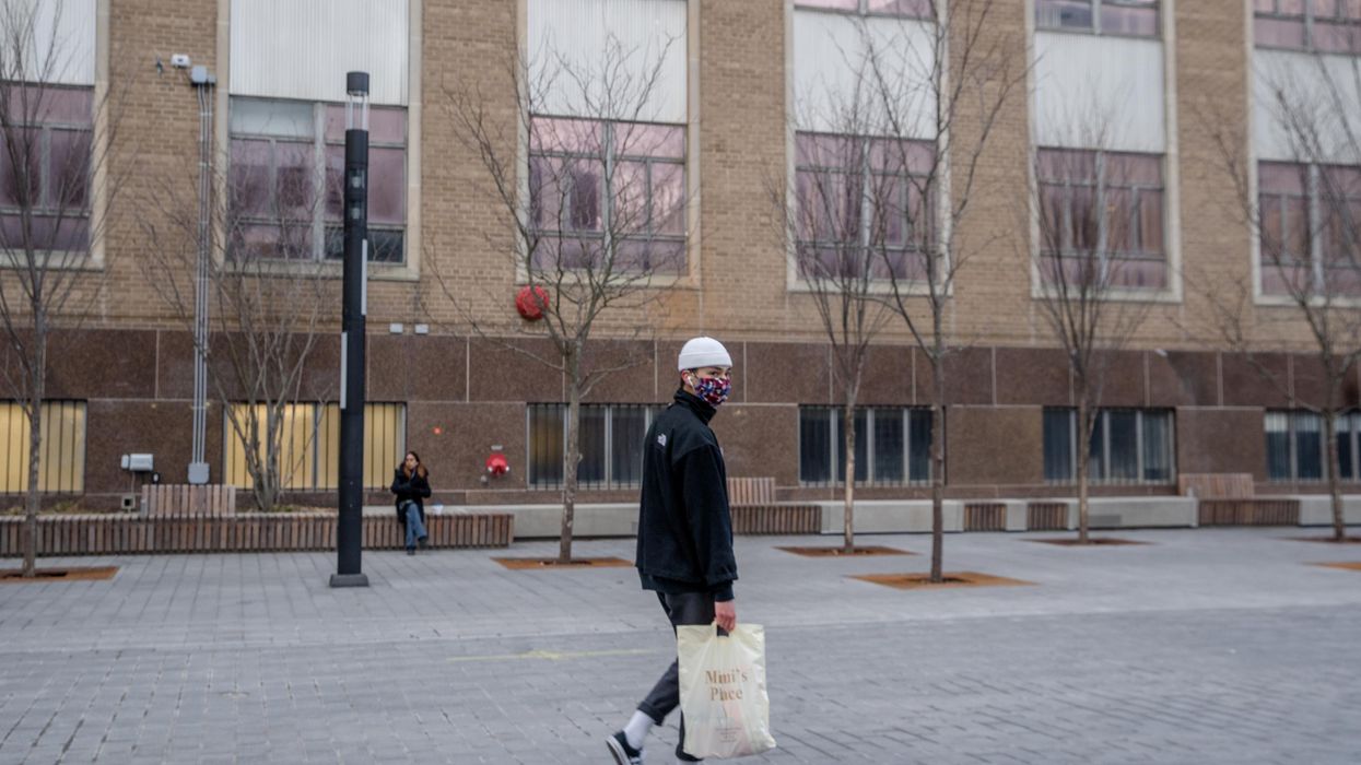 Person wearing a mask in Toronto.