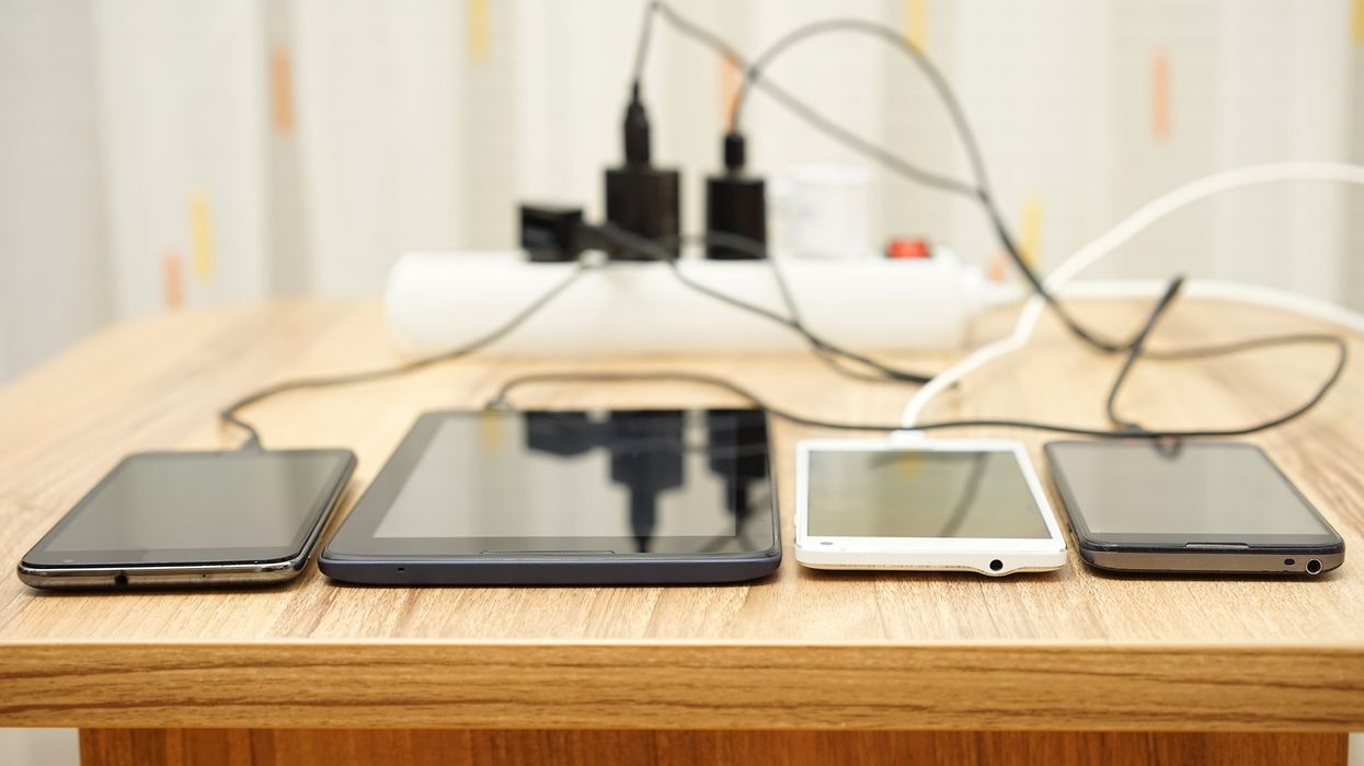 Phones being charged on a table.