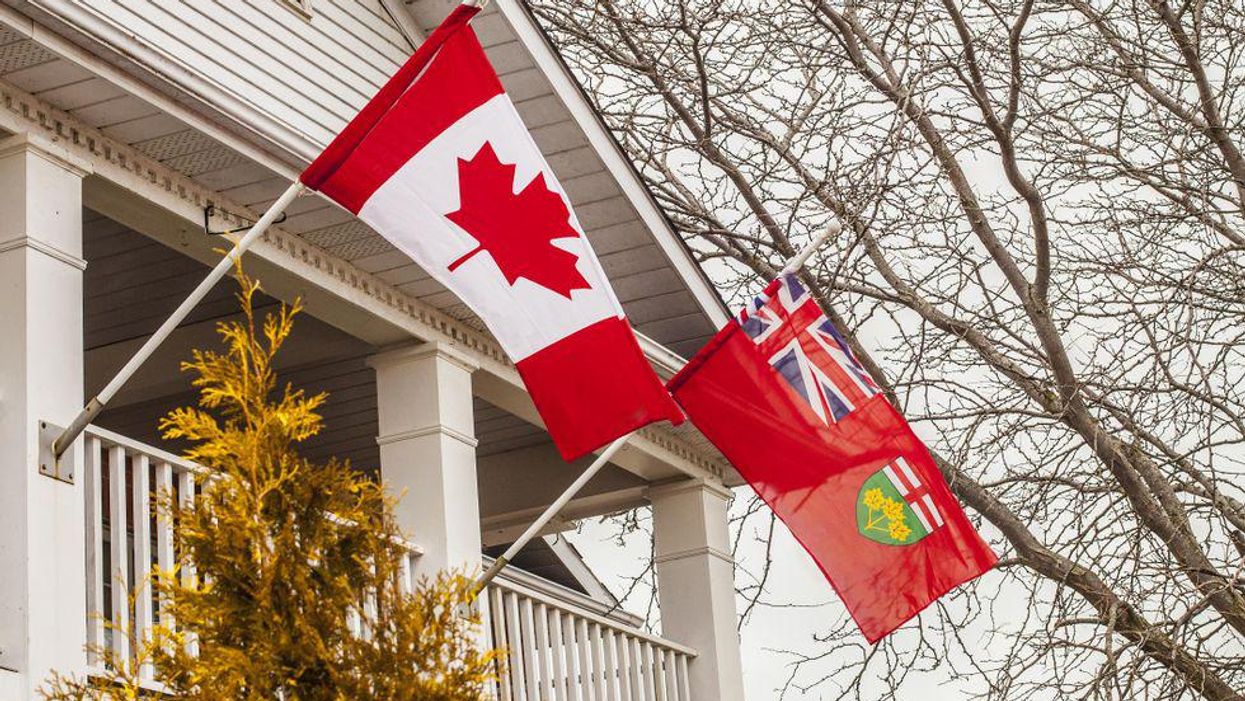 Photo of Canada and Ontario flags on a porch