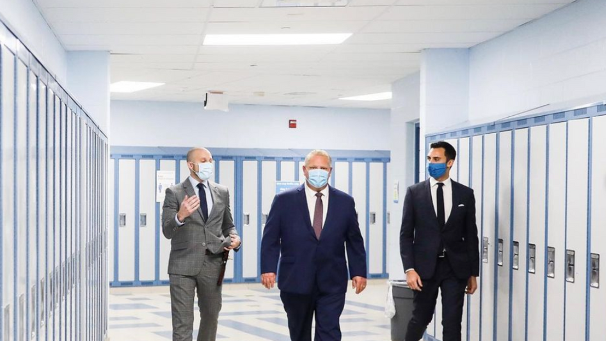 Photo of Premier Ford and Minister of Education Stephen Lecce in a high school