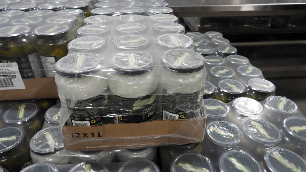 Pickle jars with white crystals inside.