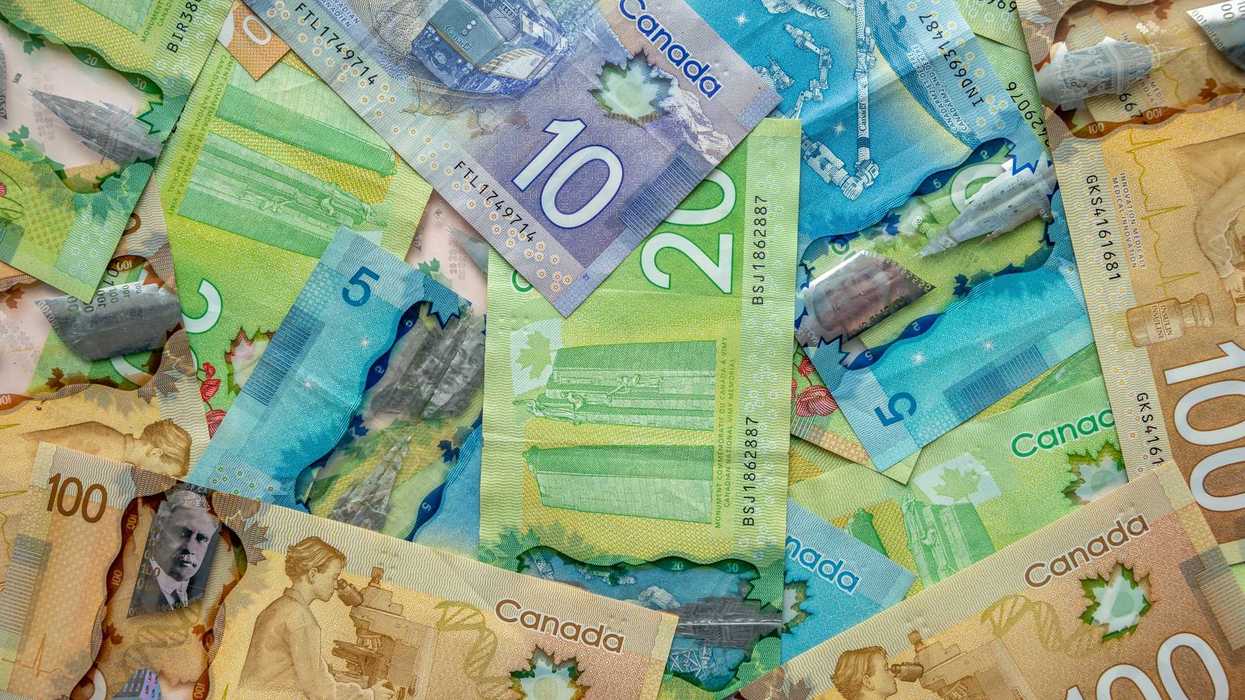 pile of $100, $20, $10 and $5 canadian banknotes