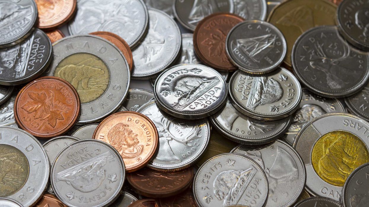 pile of canadian coins including pennies, nickels and toonies
