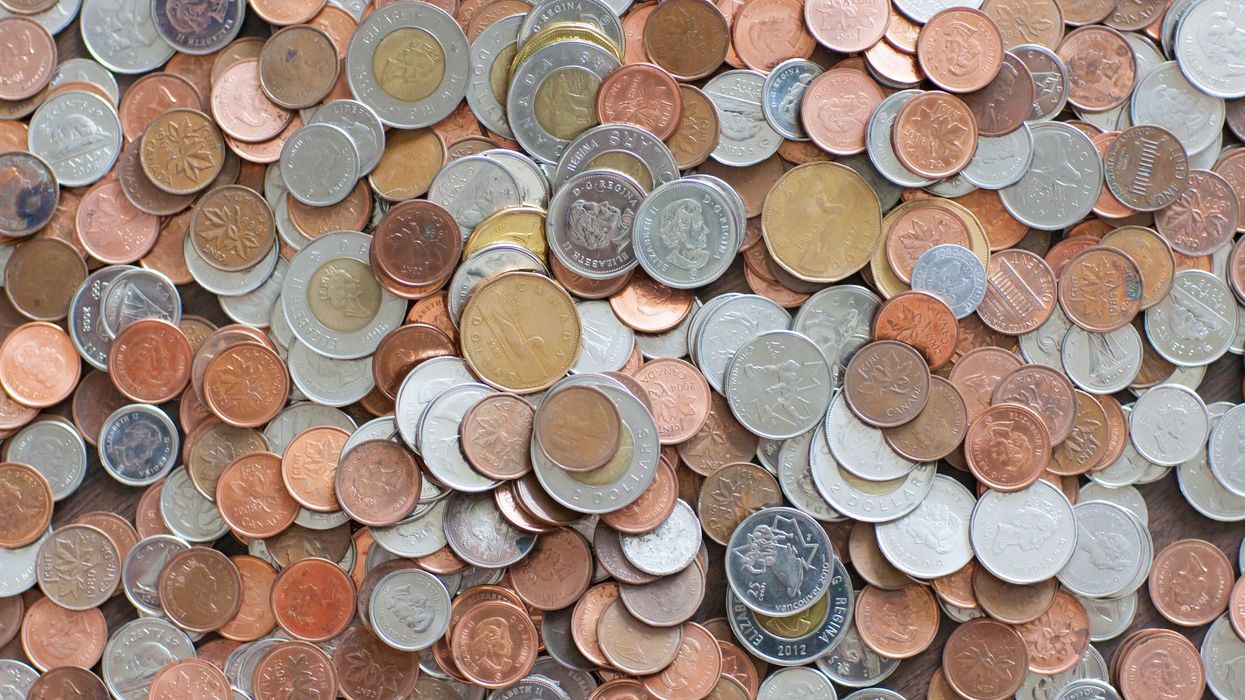 pile of canadian coins, including pennies