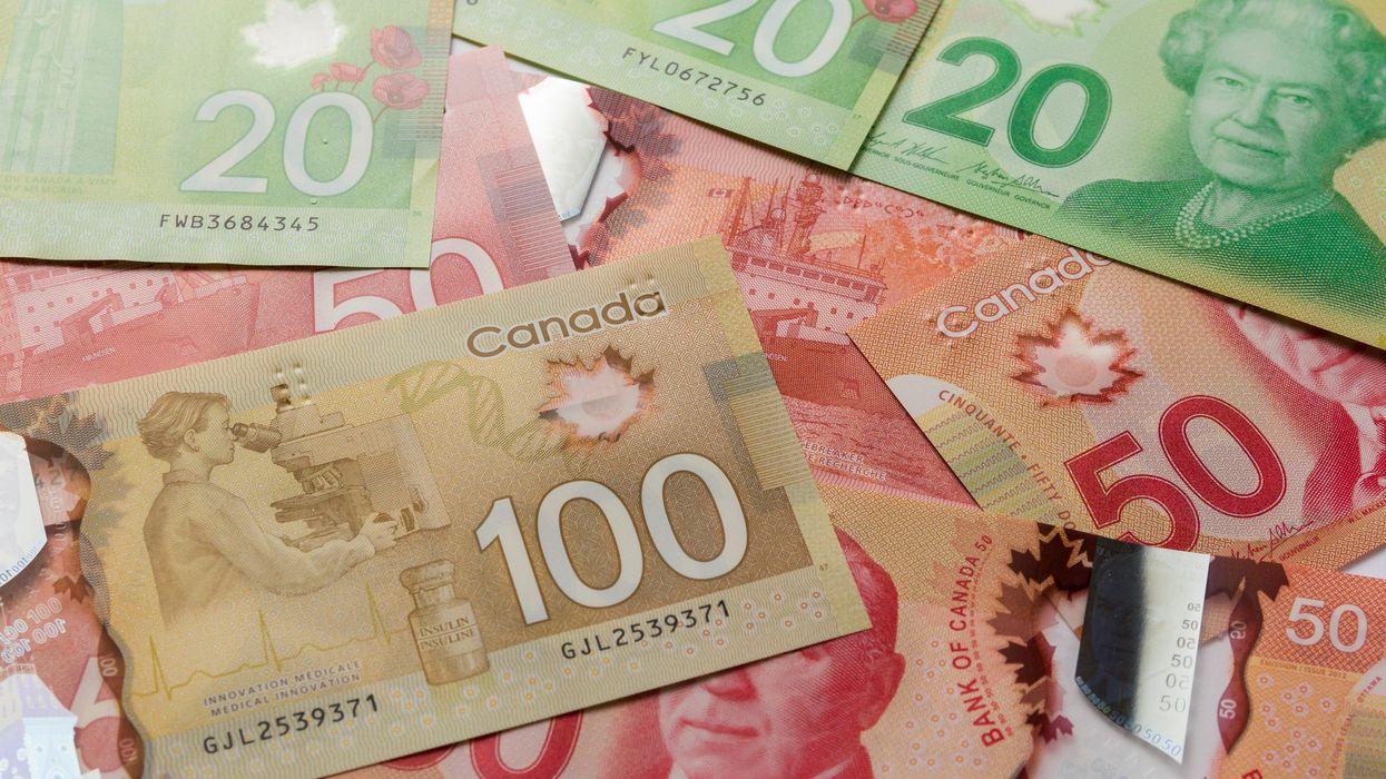 pile of canadian money including $100, $50 and $20 bills