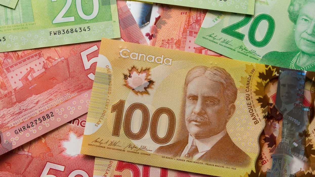pile of canadian money with $100, $50 and $20 banknotes