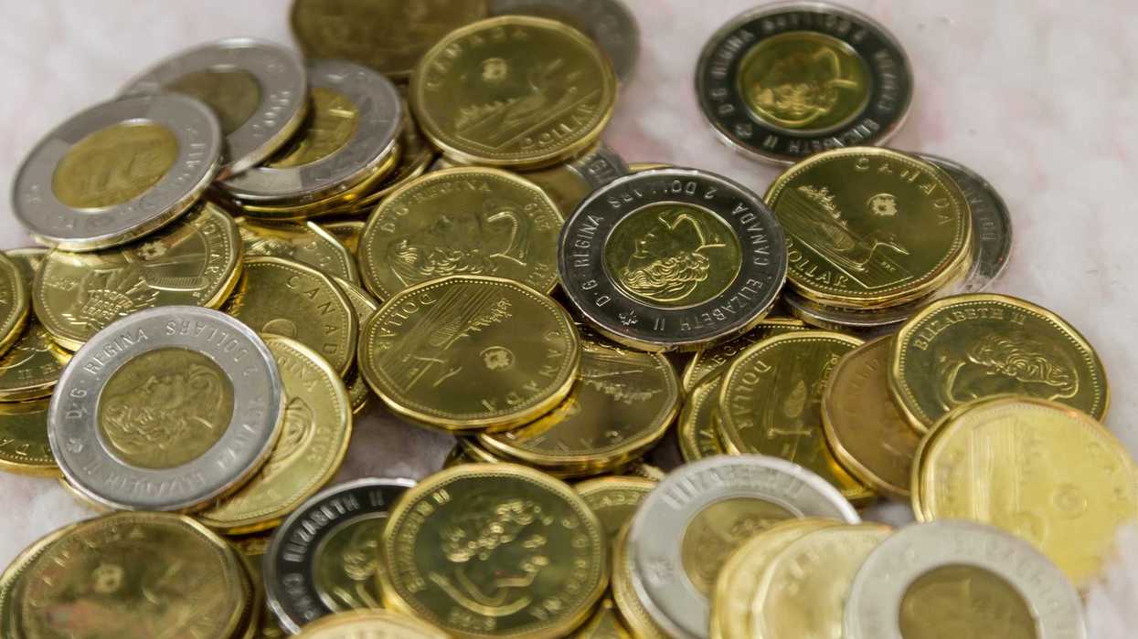 pile of canadian one dollar and two dollar coins