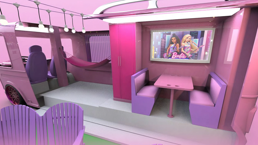Pink interior of life-sized display of Barbie's camper van.