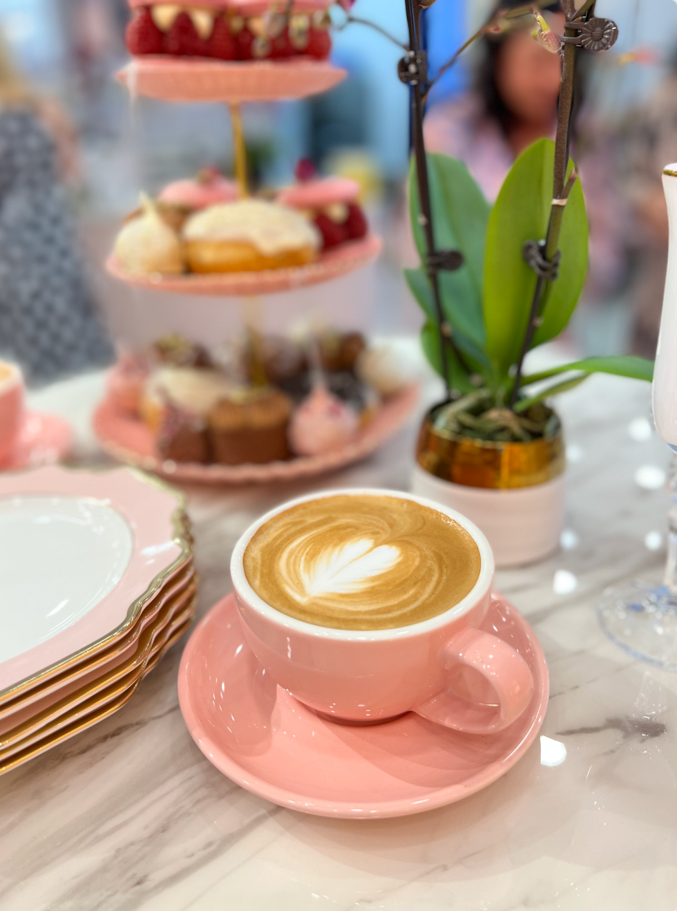 Pink mug with coffee.