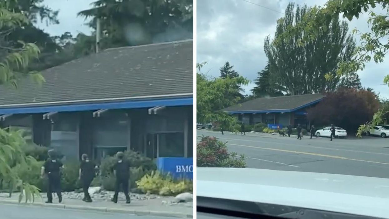 Police entering the bank.